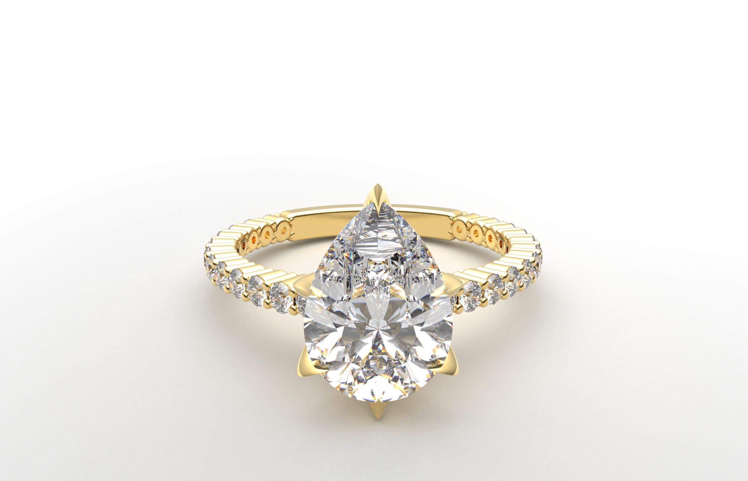 Six Prong Shared Setting pear shaped diamond ring in yellow gold