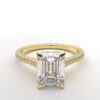 Cathedral setting emerald cut diamond with hidden halo ring with a simple prong setting in yellow gold color and french paved diamonds band