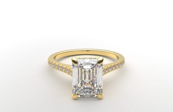 Cathedral setting emerald cut diamond with hidden halo ring with a simple prong setting in yellow gold color and french paved diamonds band