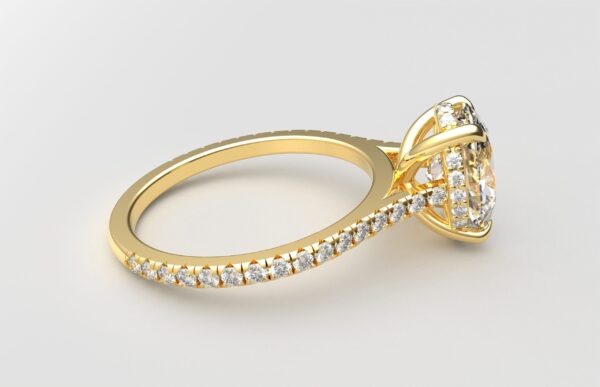 side view cathedral setting oval cut diamond with hidden halo ring with a simple prong setting in yellow gold color and french paved diamonds band