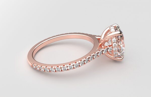 side view cathedral setting oval cut diamond with hidden halo ring with a simple prong setting in rose gold color and french paved diamonds band