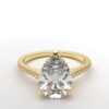 cathedral setting pear cut diamond with hidden halo ring with a simple prong setting in yellow gold color and french paved diamonds band