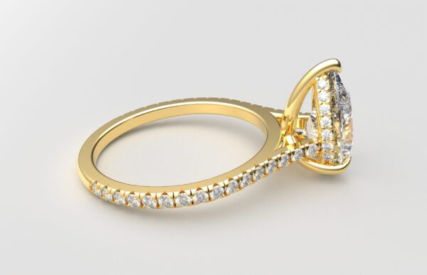 side view cathedral setting pear cut diamond with hidden halo ring with a simple prong setting in yellow gold color and french paved diamonds band