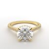 cathedral setting round cut diamond with hidden halo ring with a simple prong setting in yellow gold color and french paved diamonds band