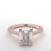 modern emerald cathedral setting diamond with hidden halo ring with a classic prong setting in rose gold color and french paved round diamonds band