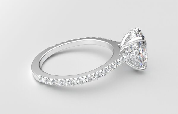 side view modern oval cathedral setting diamond with hidden halo ring with a classic prong setting in white gold color and french paved round diamonds band