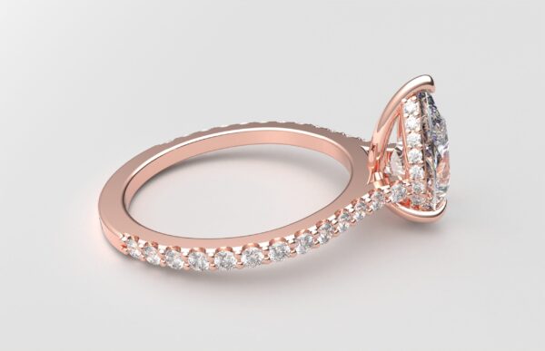 side view modern pear cathedral setting diamond with hidden halo ring with a classic prong setting in rose gold color and french paved round diamonds band