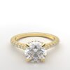 modern round cathedral setting diamond with hidden halo ring with a classic prong setting in yellow gold color and french paved round diamonds band