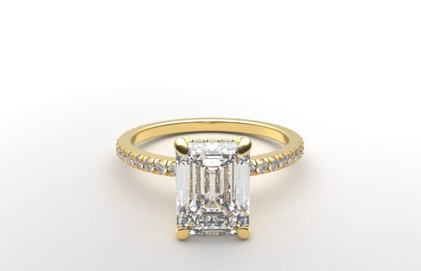 emerald diamond with hidden halo ring with a classic 4 prong setting in yellow gold color and french paved diamond band