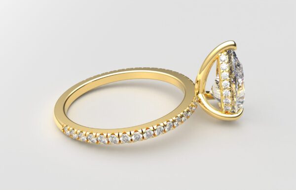 side view pear diamond with hidden halo ring with a classic 3 prong setting in yellow gold color and french paved diamond band