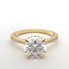 round diamond with hidden halo ring with a classic 4 prong setting in yellow gold color and french paved diamond band