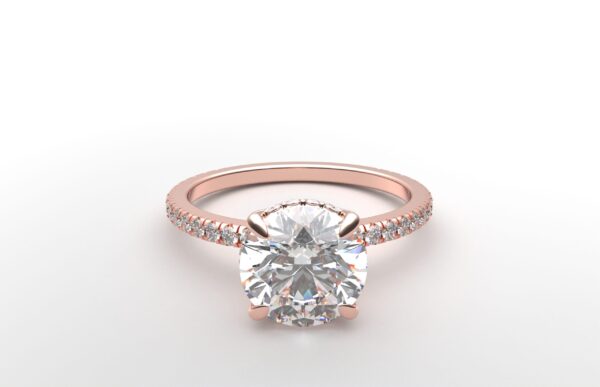 round diamond with hidden halo ring with a classic 4 prong setting in rose gold color and french paved diamond band