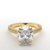 modern cathedral setting french pave oval diamond ring in yellow gold with a hidden halo