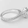 side view modern catherdral setting french pave oval diamond ring in white gold with a hidden halo