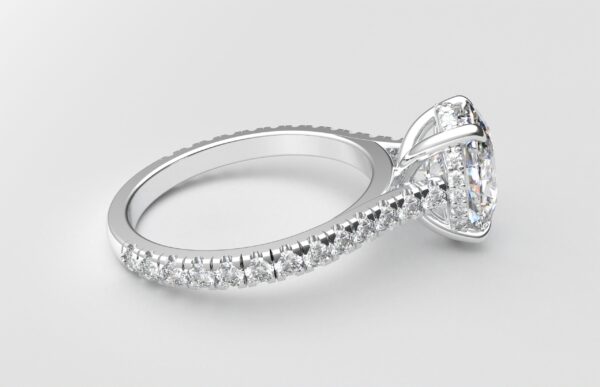 side view modern catherdral setting french pave oval diamond ring in white gold with a hidden halo