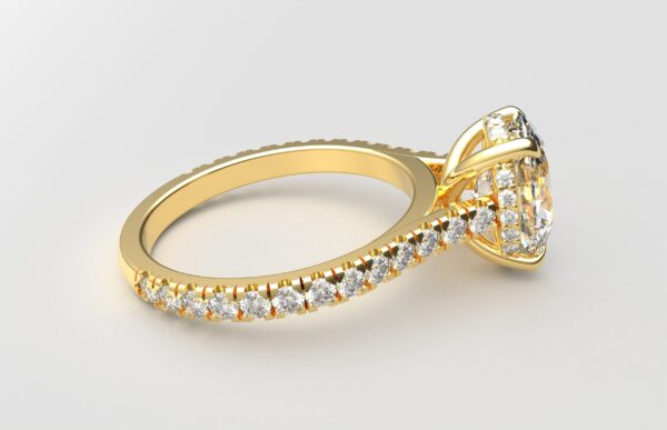 side view modern catherdral setting french pave oval diamond ring in yellow gold with a hidden halo