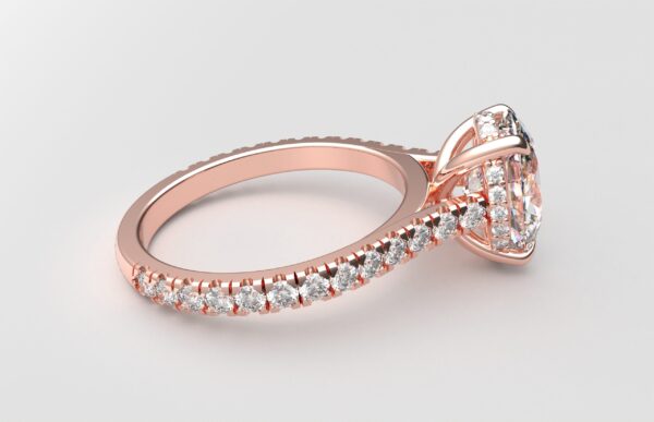 side view modern catherdral setting french pave oval diamond ring in rose gold with a hidden halo