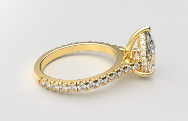 side view modern catherdral setting french pave pear diamond ring in yellow gold with a hidden halo