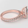 side view modern catherdral setting french pave pear diamond ring in rose gold with a hidden halo