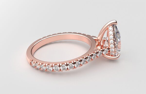 side view modern catherdral setting french pave pear diamond ring in rose gold with a hidden halo