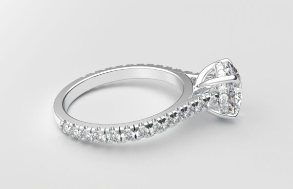 side view modern catherdral setting french pave round diamond ring in white gold with a hidden halo