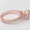 side view modern catherdral setting french pave round diamond ring in rose gold with a hidden halo