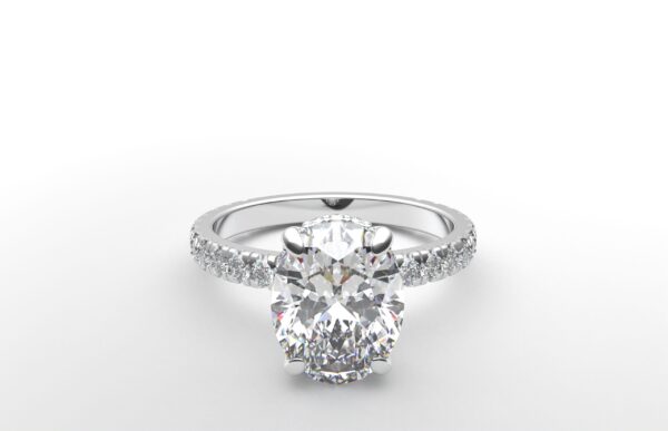 classic french pave oval diamond ring in white gold with a hidden halo