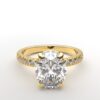 classic french pave oval diamond ring in yellow gold with a hidden halo