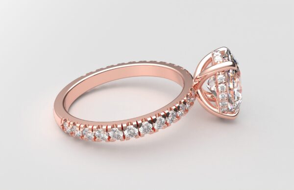 side view classic french pave oval diamond ring in rose gold with a hidden halo