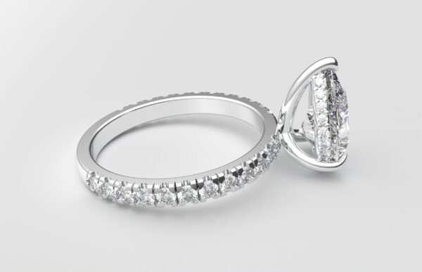 side view classic french pave pear diamond ring in white gold with a hidden halo