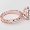 side view classic french pave pear diamond ring in rose gold with a hidden halo