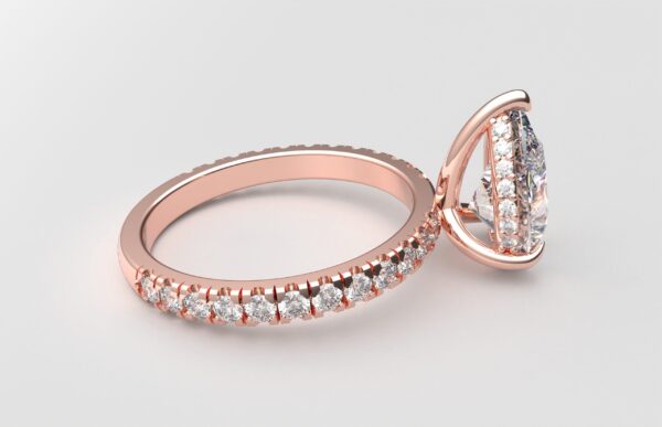 side view classic french pave pear diamond ring in rose gold with a hidden halo