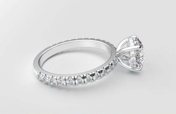 Side view classic french pave round diamond ring in white gold with a hidden halo