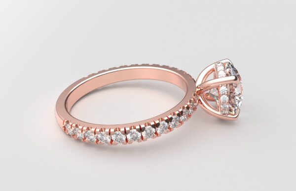 Side view classic french pave round diamond ring in rose gold with a hidden halo