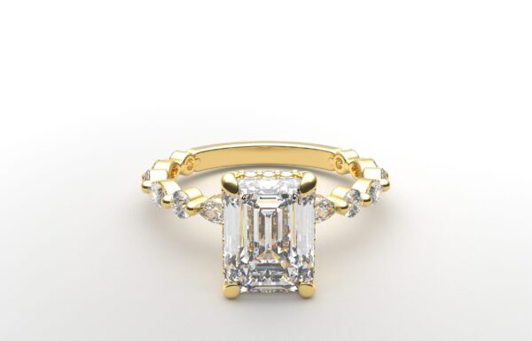 Emerald solitaire diamond ring in yellow gold with round and marquise diamond band hidden halo