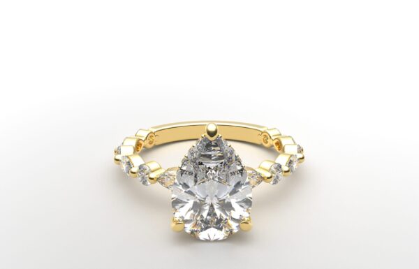 pear solitaire diamond ring in yellow gold with round and marquise diamond band hidden halo