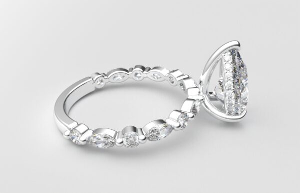 side view pear solitaire diamond ring in white gold with round and marquise diamond band hidden halo