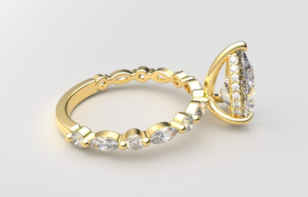 side view pear solitaire diamond ring in yellow gold with round and marquise diamond band hidden halo