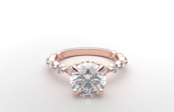 round solitaire diamond ring in rose gold with round and marquise diamond band hidden halo