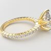 Side view Classic single shared prong tulip setting pear diamond yellow gold ring 6 prong