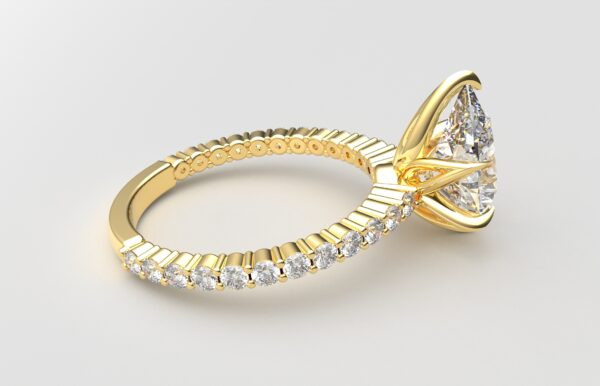 Side view Classic single shared prong tulip setting pear diamond yellow gold ring 6 prong